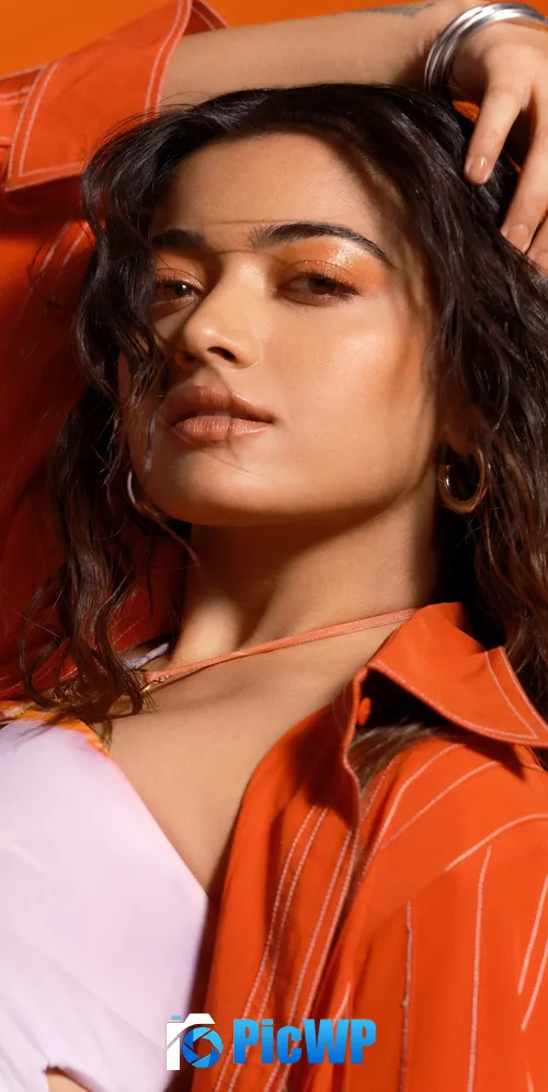 Rashmika Mandanna Orange background 3K Mobile Wallpaper