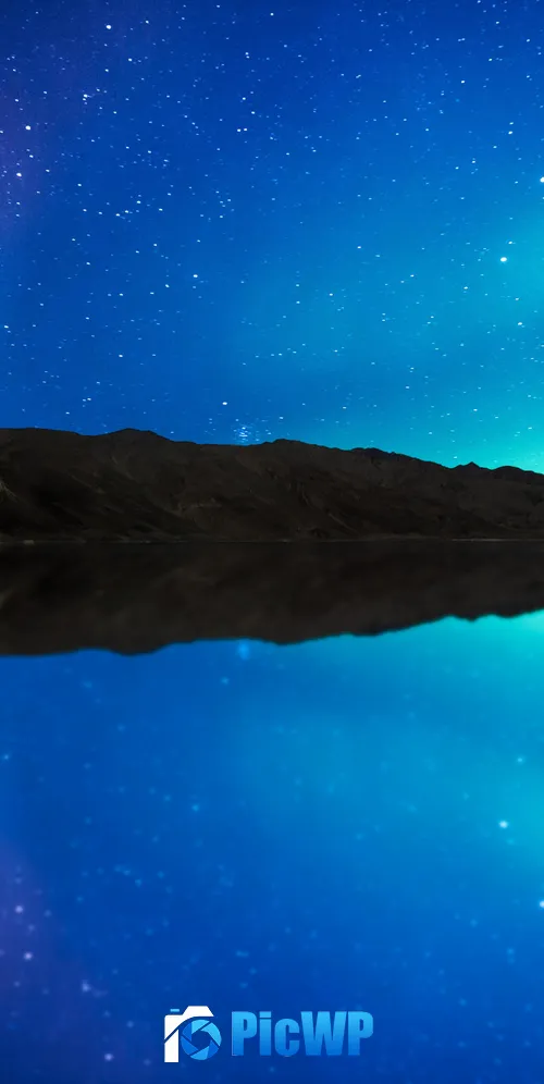 Aurora borealis reflected in the water of a lake 3K Mobile Wallpaper