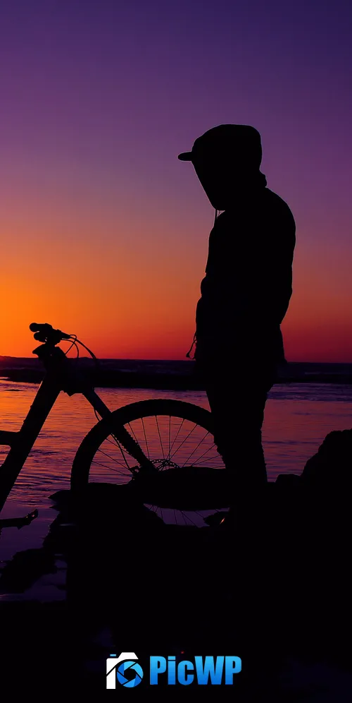 Silhouette Man in Hoodie during Sunset 3K Mobile Wallpaper
