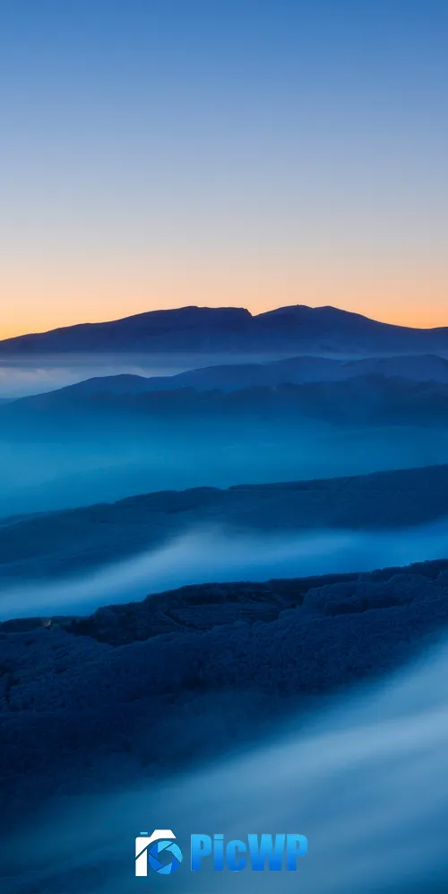 Mountain covered in fog at sunset 3K Mobile Wallpaper