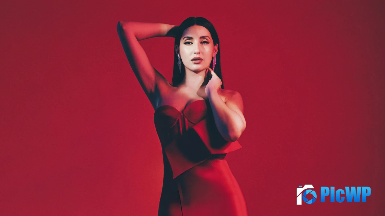 Nora Fatehi Red background 4K PC Wallpaper