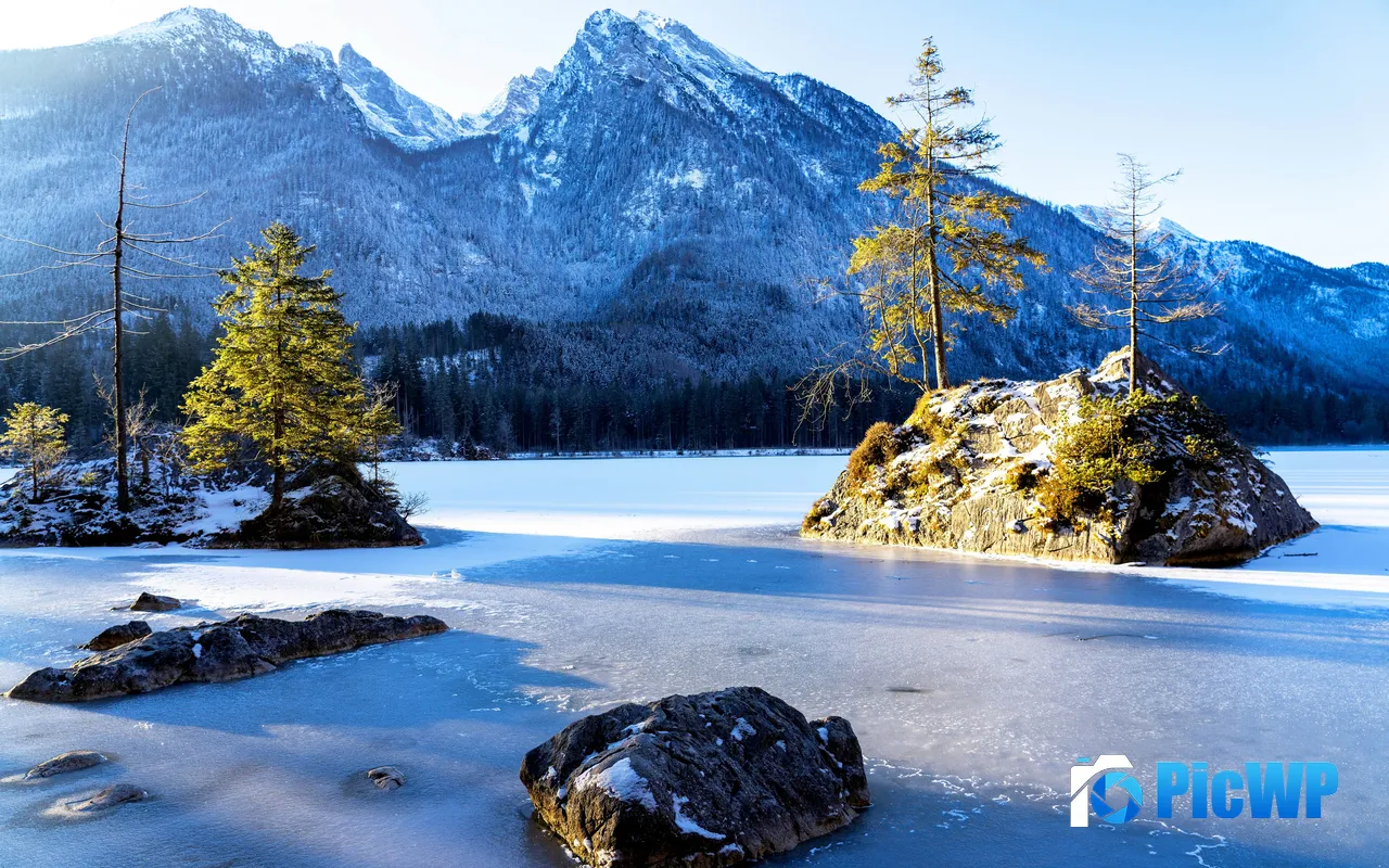 Frozen Lake Snowy Mountains Stone Sunlight Germany 5K PC Wallpaper