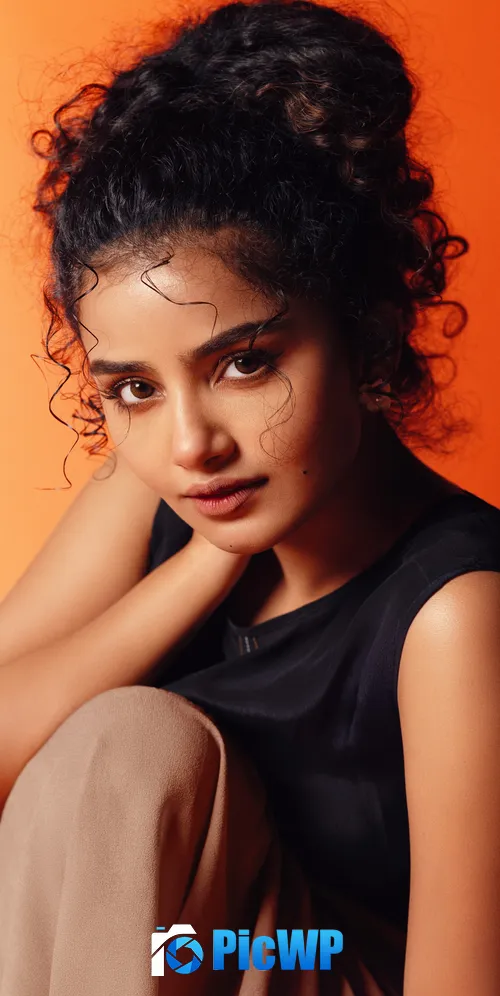 Anupama Parameswaran Orange background 3K Mobile Wallpaper