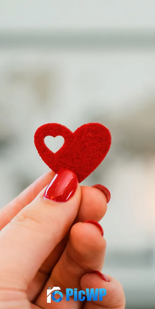 Red heart in Woman's hand 3K Mobile Wallpaper