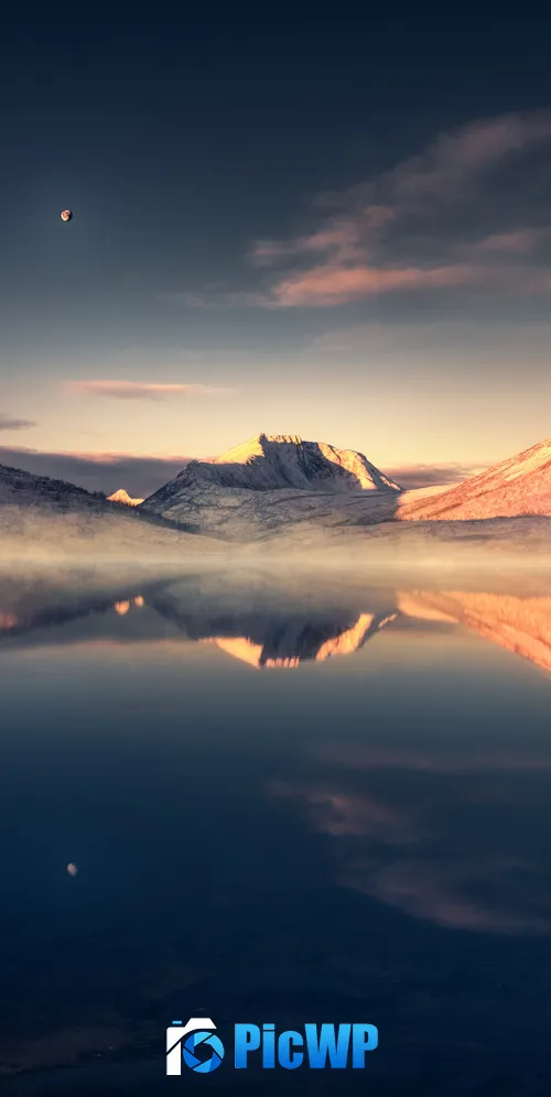 Calm lake surrounded by snow covered mountains 3K Mobile Wallpaper