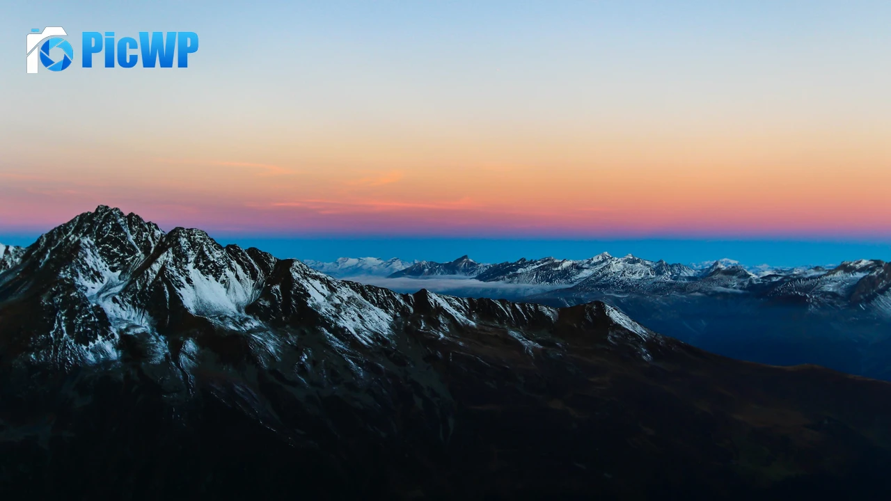 Snow covered Mountain range 4K PC Wallpaper