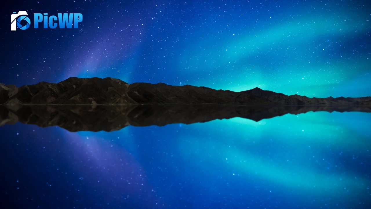 Aurora borealis reflected in the water of a lake 4K PC Wallpaper