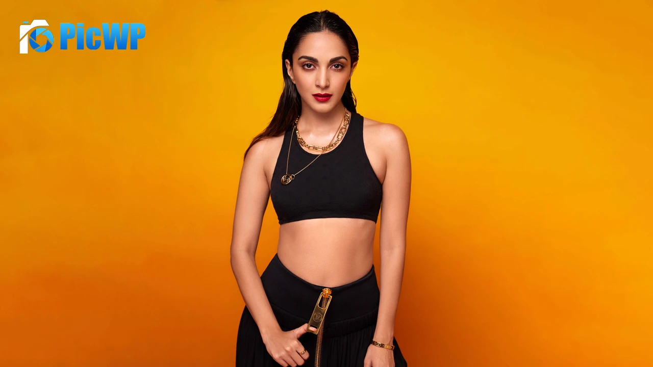 Kiara Advani Orange background 6K PC Wallpaper